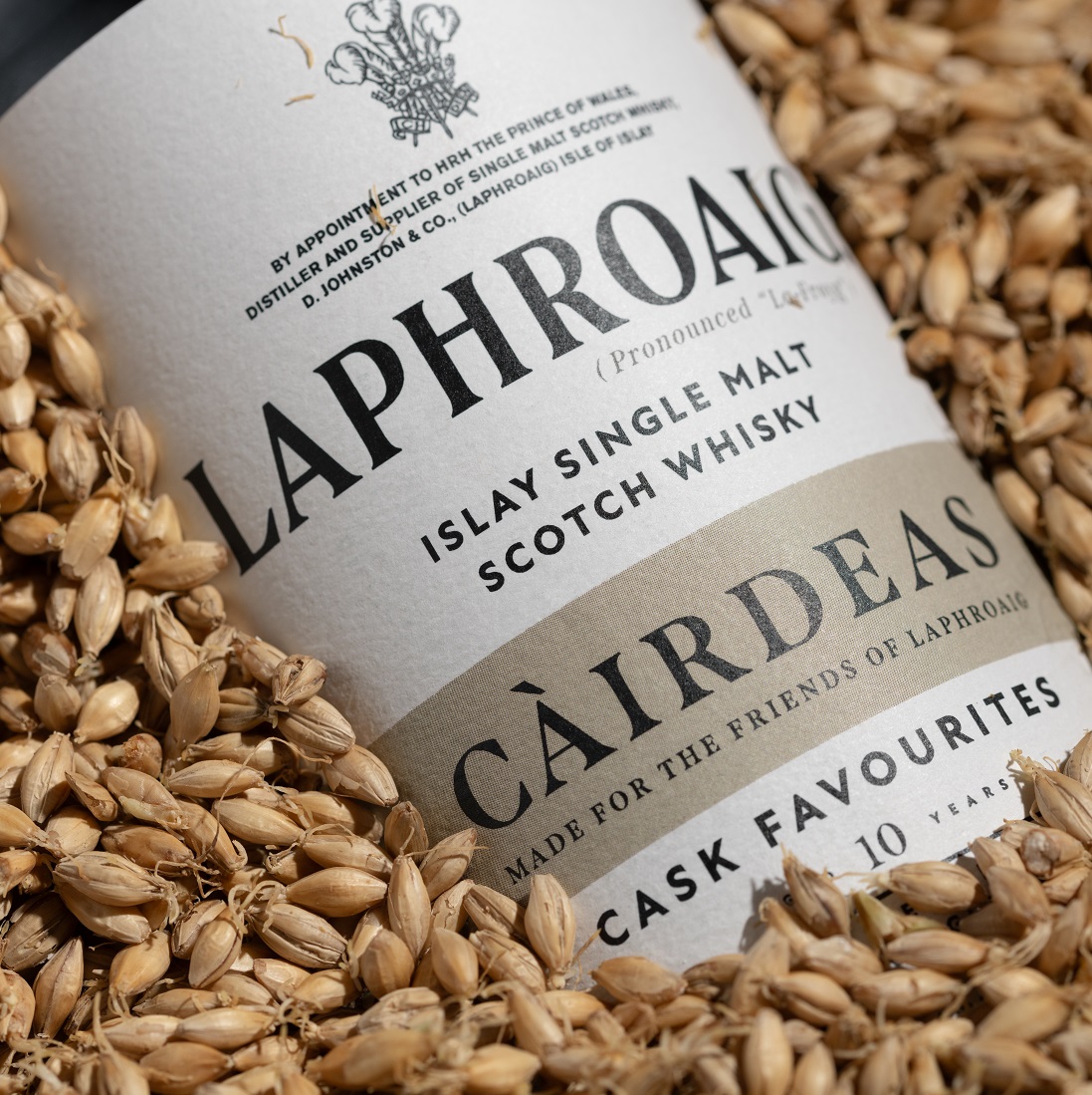 Laphroaig Càirdeas bottle in malt grains