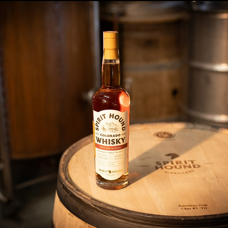 Spirit Hound Distillers Bottled in Bond American Single Malt bottle on barrel