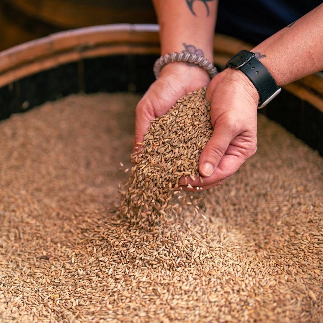 Casey Jones Distillery Mash Maker hands grain barrel