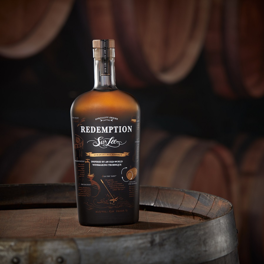 Redemption Sur Lee Straight Rye Whiskey bottle in rickhouse